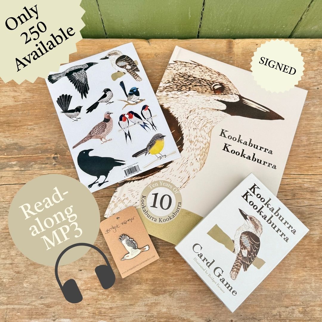 A styled flat-lay of Kookaburra-themed reading materials on a wooden surface, including a book, a card game, a sticker sheet with bird illustrations, and an MP3 read-along cover with headphones icon. Promotional text badges read 'Only 250 Available', 'Signed', and 'Read-along MP3'.