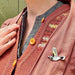 new holland honeyeater in flight pin on red cardigan