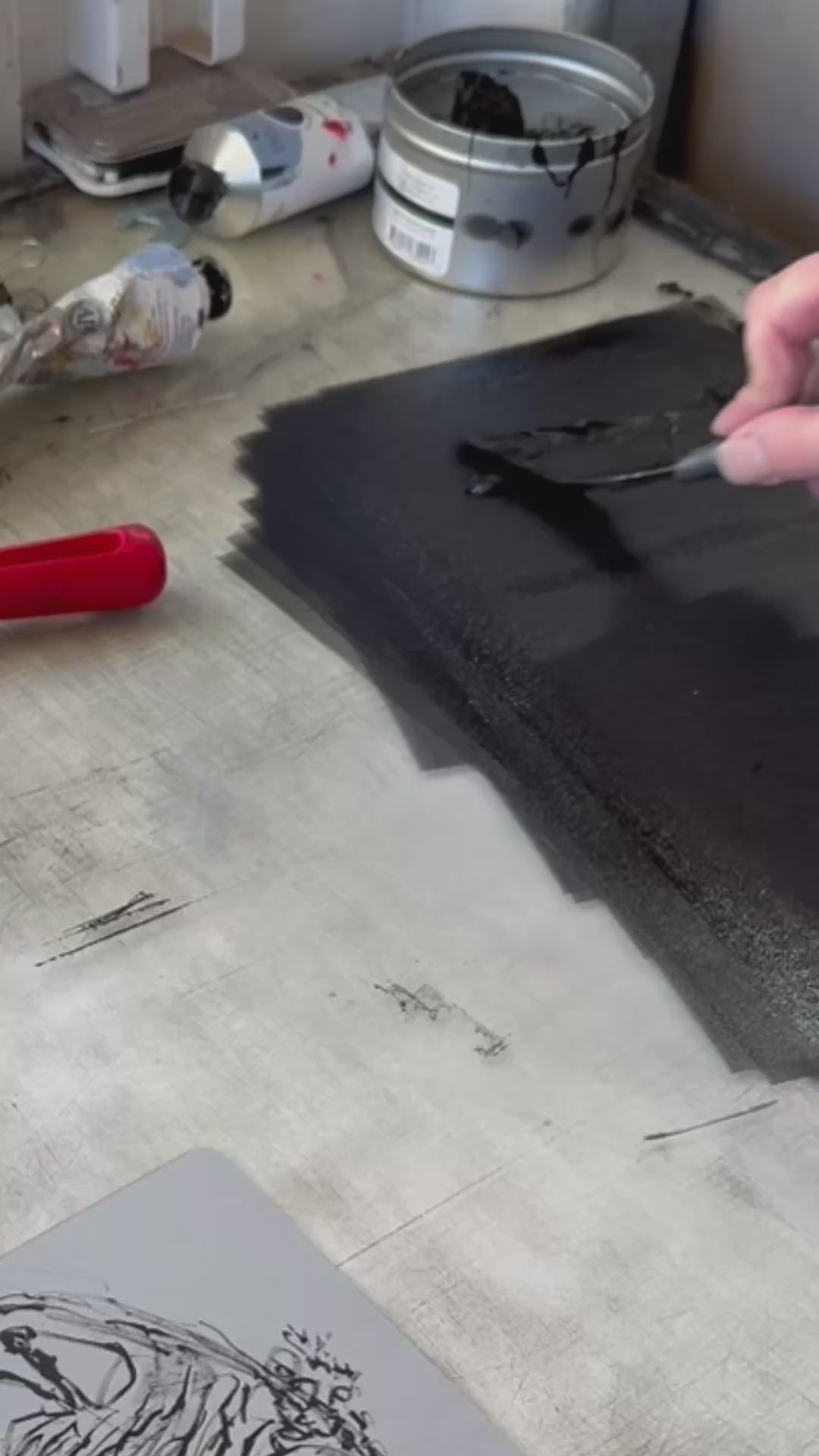 Load video: film showing the process of making a lithograph from an aluminium plate.